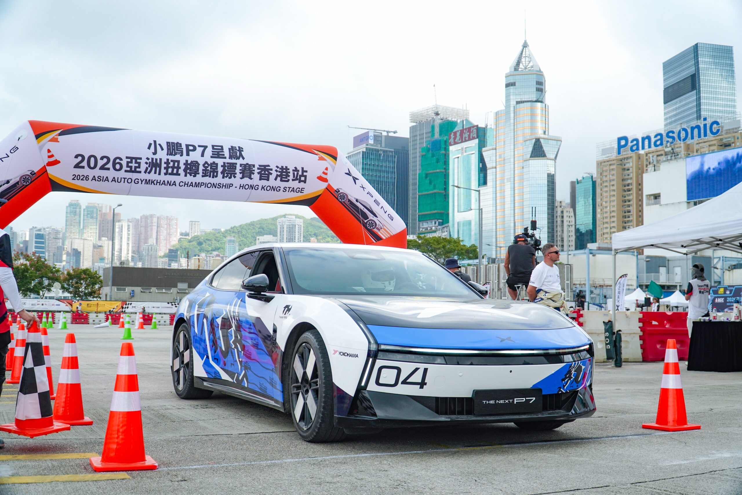 XPENG New P7 with race number 04 between cones at the start arch of the 2026 Asia Auto Gymkhana Championship in Hong Kong