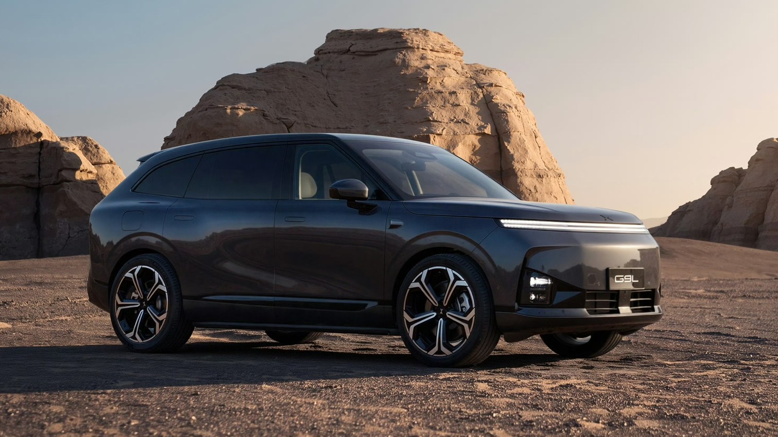 XPENG G9L in Fjord Grey, front three-quarter view in a desert landscape