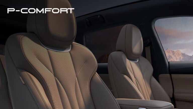 P-Comfort hub card - tan leather seats with mountain sunset through the window