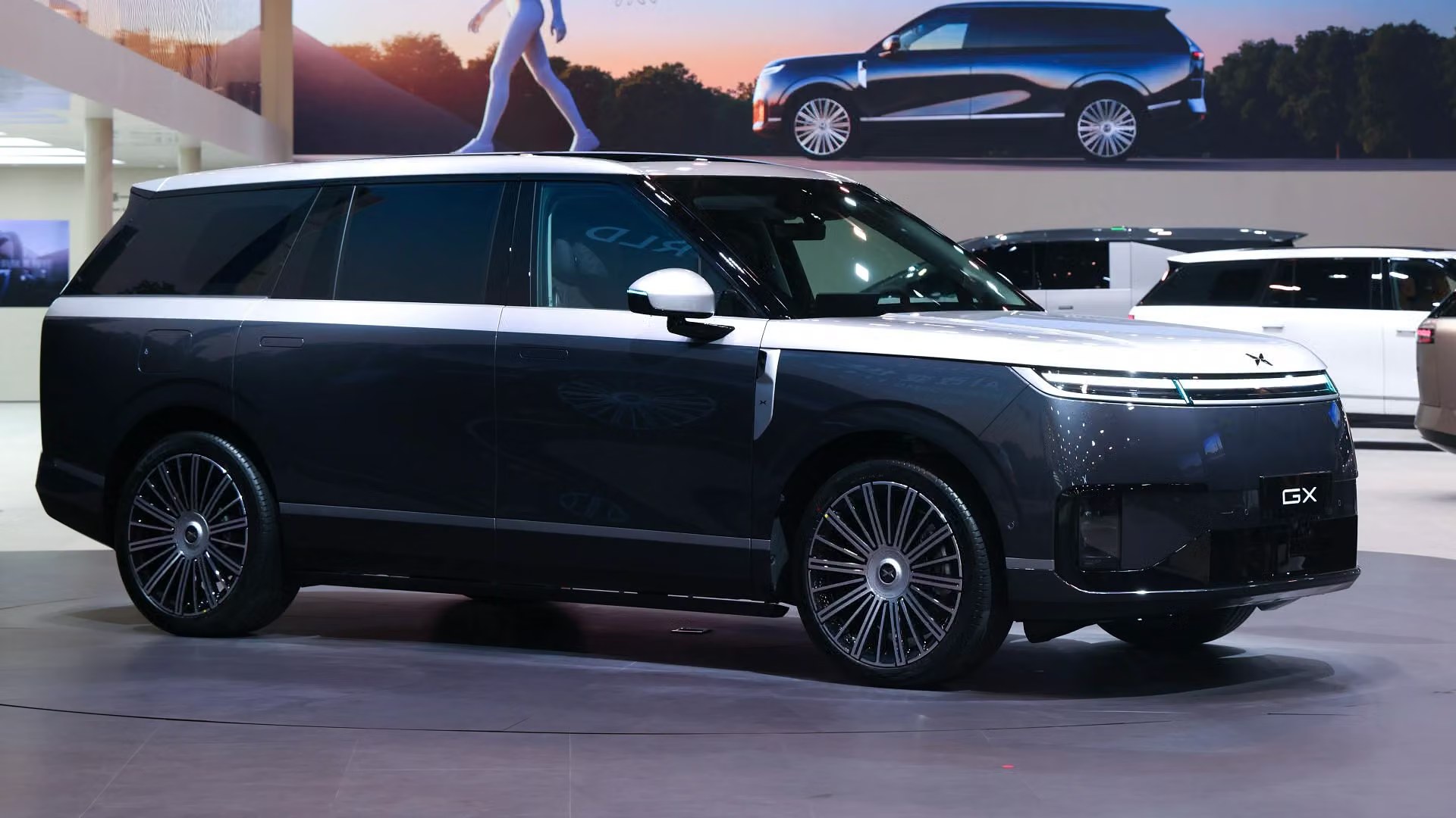 XPENG GX two-tone right-side view at an auto show
