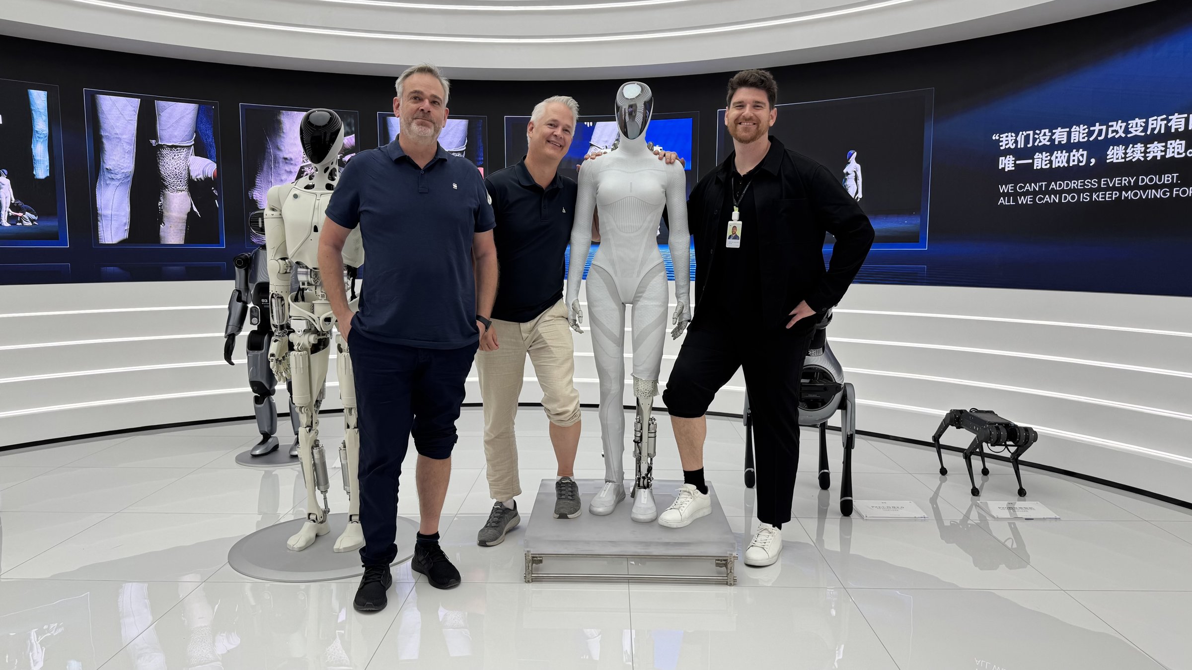 Kristian Wilsky (beta tester and owner of XPENG Guru), Stefan Duvander (a Swedish beta tester) and Joachim Vishart Hummel-Gryholm of XPENG Denmark beside the Next-Gen IRON, one lower leg still opened, in the XPENG AI Mobility Experience Center in Guangzhou