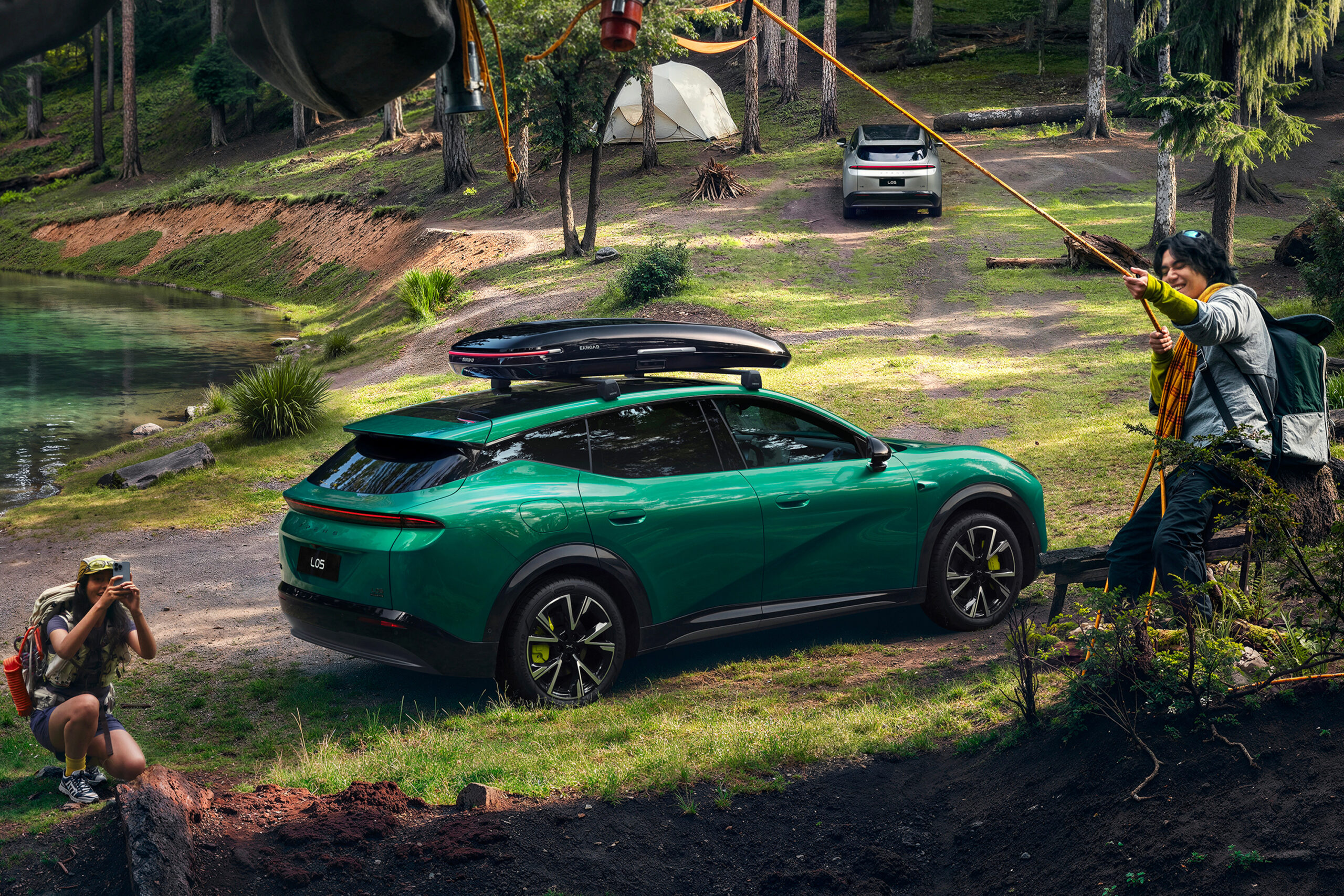 Green L05 viewed from the rear quarter with a roof box