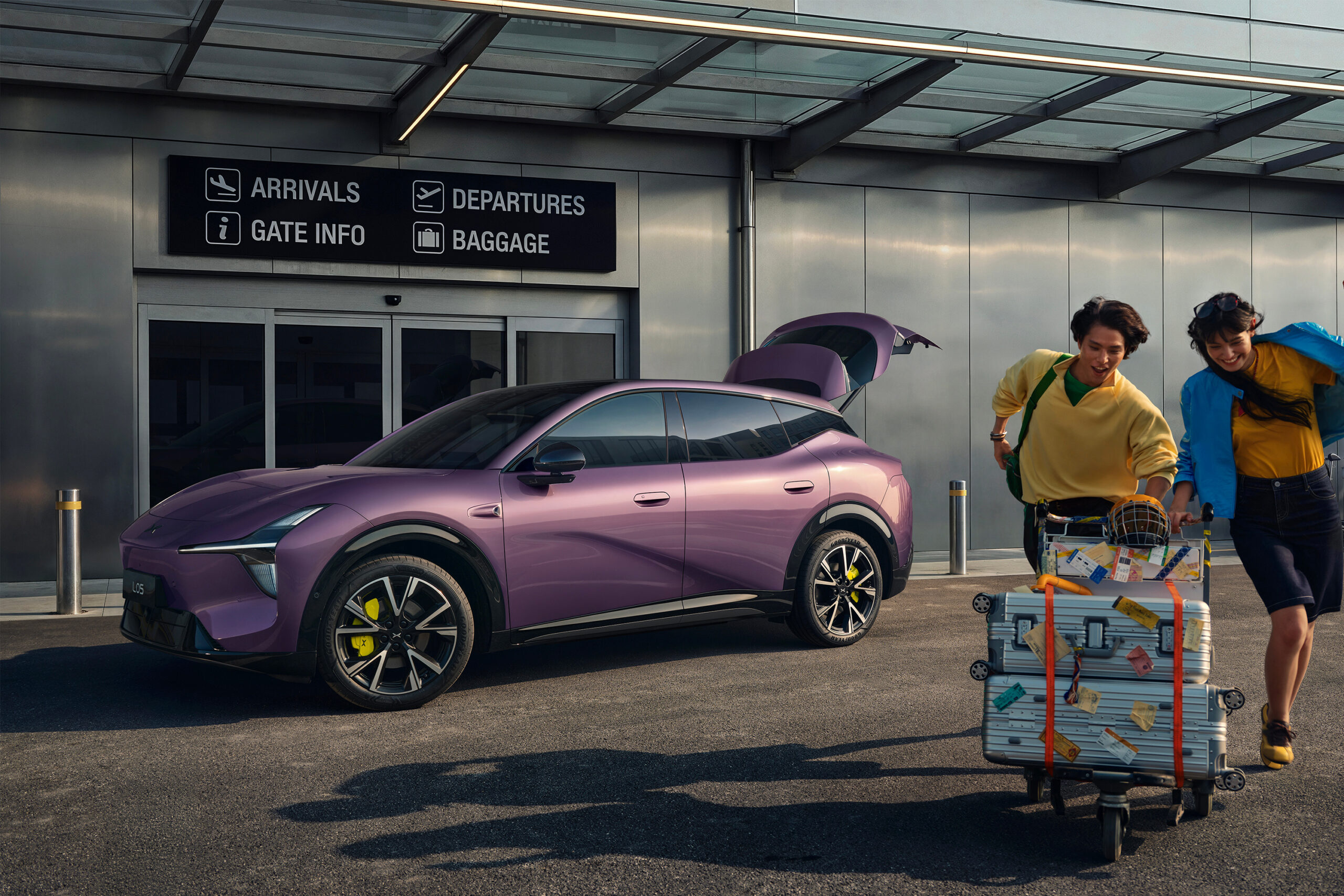 Purple L05 with its tailgate open outside a terminal