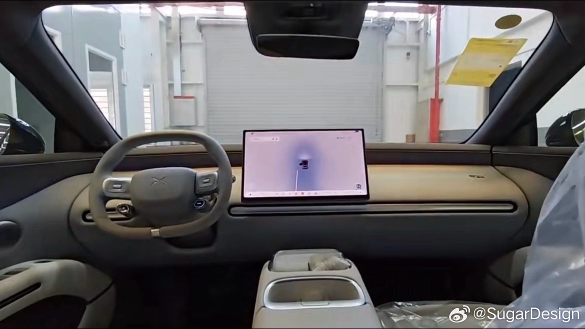 Cabin with centre display and steering wheel