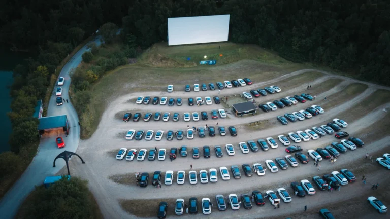 Aerial view of XPENG vehicles facing the drive-in cinema screen