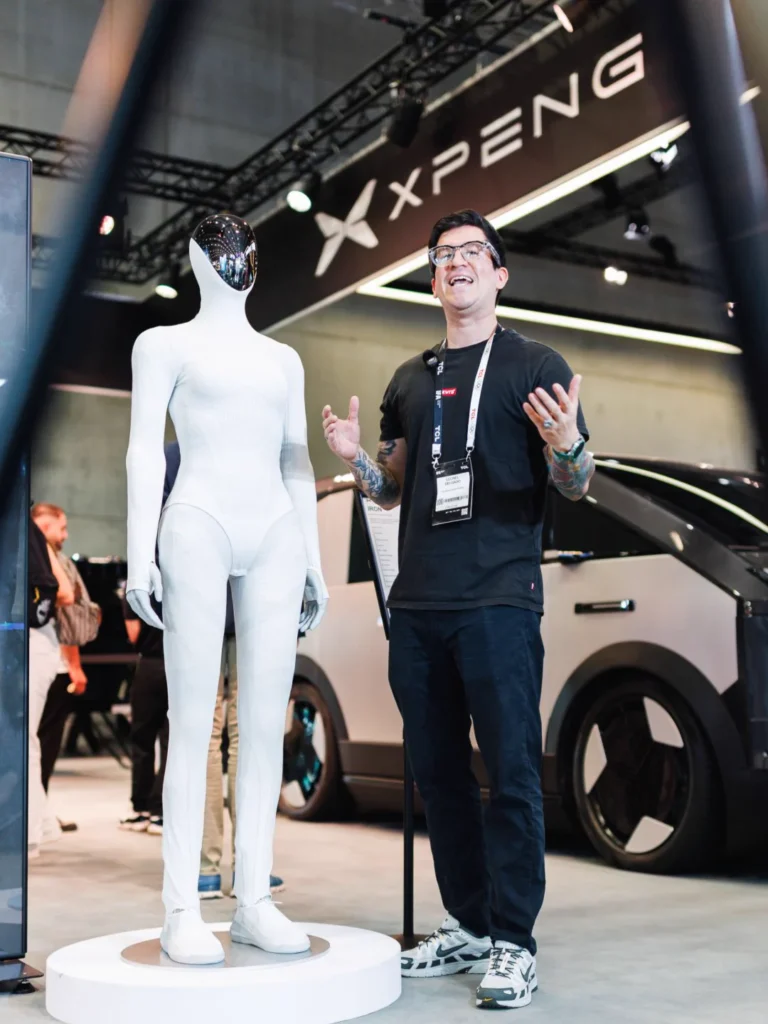 IRON robot and a visitor at the XPENG IFA stand