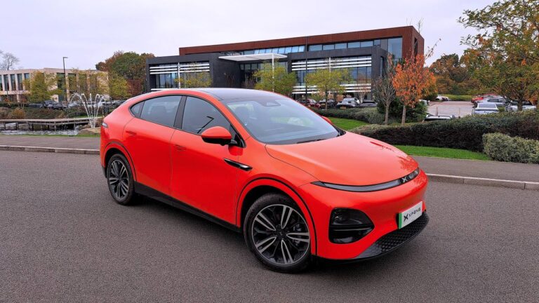 Orange XPENG G6 outside the offices of its British distributor