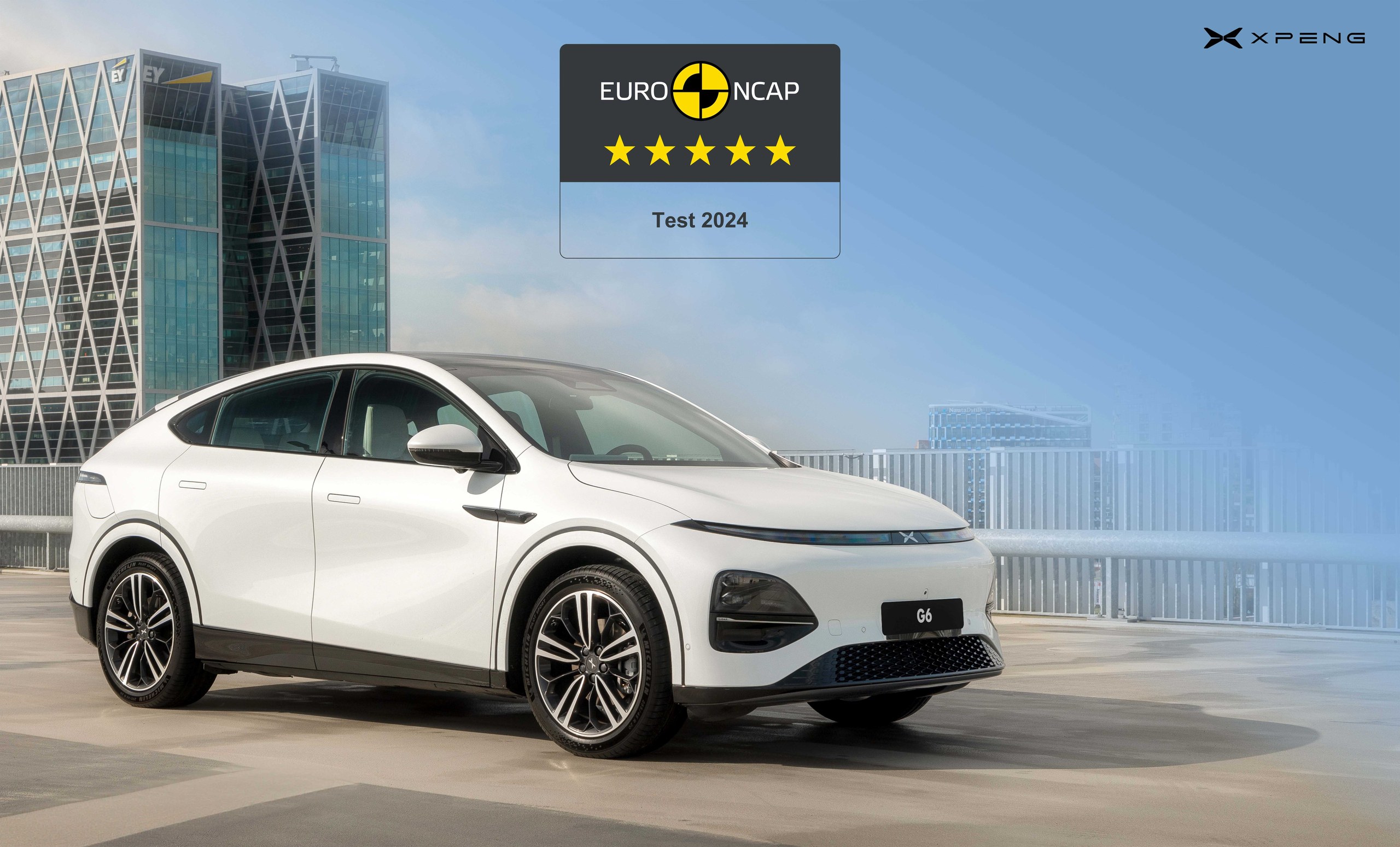 White XPENG G6 on a rooftop car park with a Euro NCAP five-star Test 2024 badge