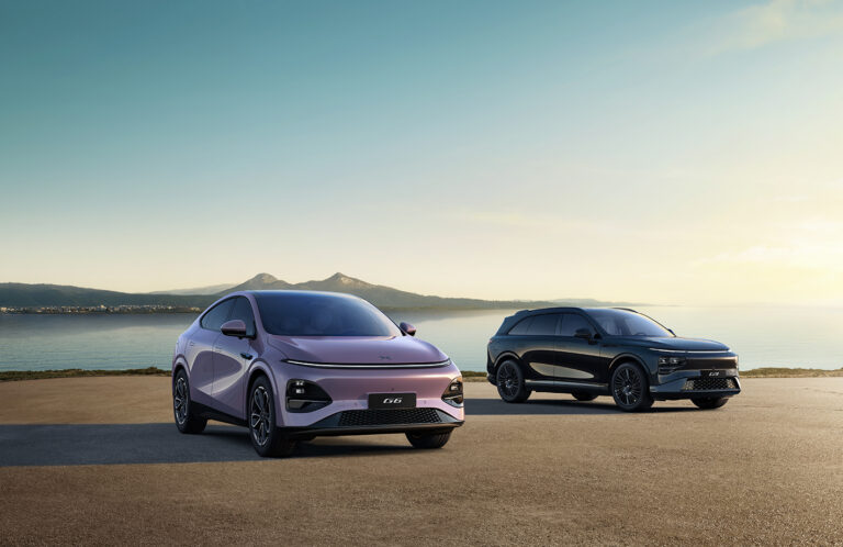 New XPENG G6 in Stellar Purple and G9 Black Edition on a headland at dusk