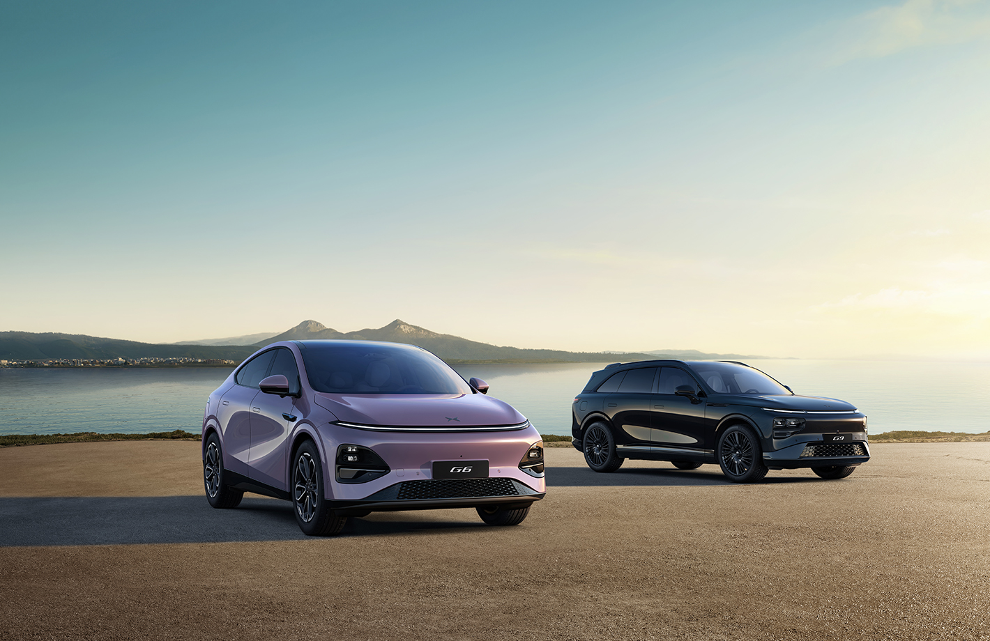 New XPENG G6 in Stellar Purple and G9 Black Edition on a headland at dusk