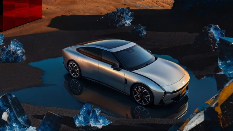 Silver next-generation XPENG P7 standing on a sheet of water in a dark volcanic set with blue ice-like boulders