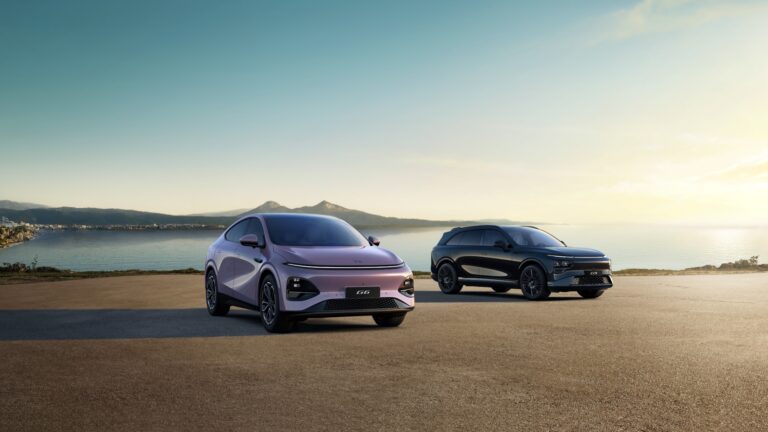 A pale mauve New XPENG G6 and a black New G9 parked on a coastal headland at sunrise