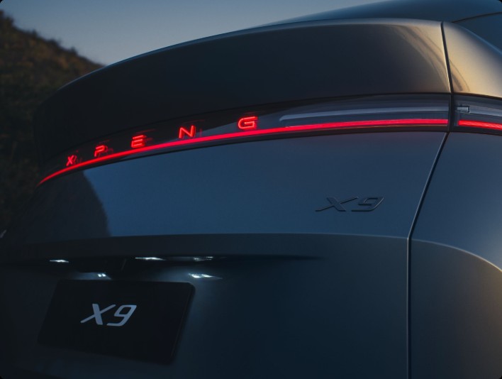 XPENG X9 rear detail - illuminated XPENG lettering in the tail light bar